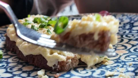 Cutting Open faced egg salad sandwich on a plate 動画素材 332689640