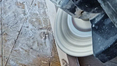 Cutting or grinding tiles with an angle grinder 動画素材 346035891