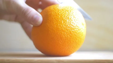 Cutting An Orange close up shot Stock Footage 234801292