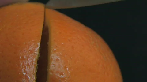 Cutting an Orange fruit HD Stock Footage 504345