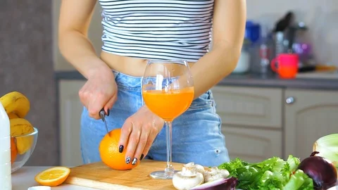 Cutting orange fruit for squeezing fresh juice. 스톡 동영상 111463934