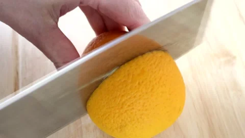 Cutting An  Orange In Half Close-up 스톡 동영상 134175571