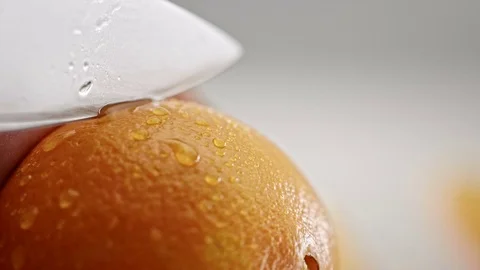 Cutting an orange in half Stock-Footage 69938144
