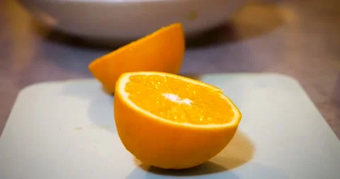 Cutting an orange with a knife Stock Footage 229233188