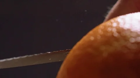 Cutting orange peels for garnish Stock Footage 83862575