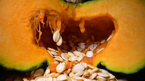 Cutting orange pumpkin with seeds close up Stock Footage 290390079