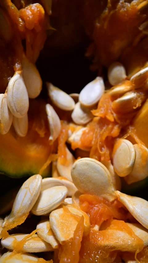 Cutting orange pumpkin with seeds close up Video stock 313630866