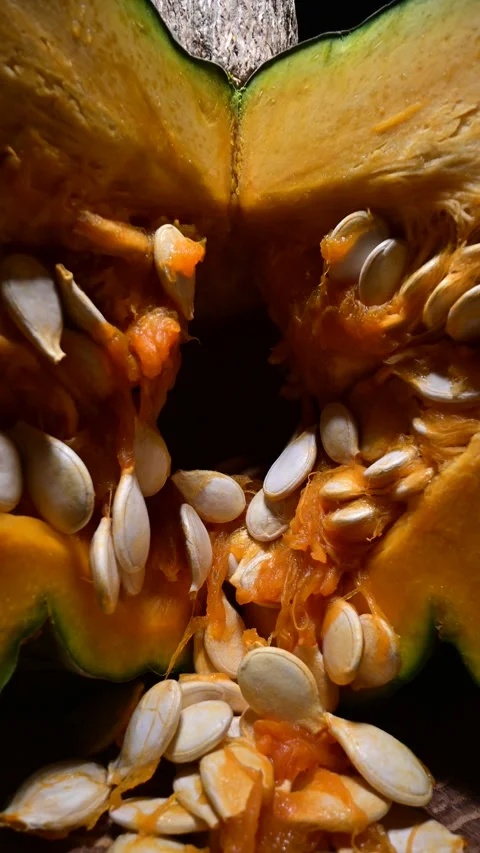 Cutting orange pumpkin with seeds close up Video stock 313630933