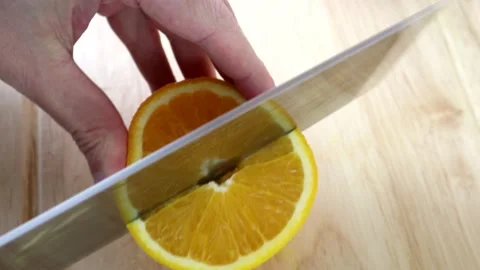 Cutting An Orange Into Quarters 스톡 동영상 134175580
