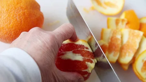 Cutting orange into rounds Video stock 104784509