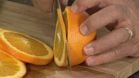 Cutting Orange Slices close up Stock Footage 95793973