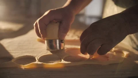 Cutting out circles from raw dough. Stock Footage 168533983