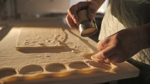 Cutting out circles from raw dough. Stock Footage 168534082