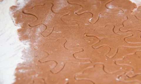 Cutting out  a gingerbread background or texture Stock Photos
