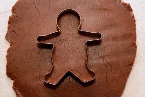 Cutting out a gingerbread man Stock Photos