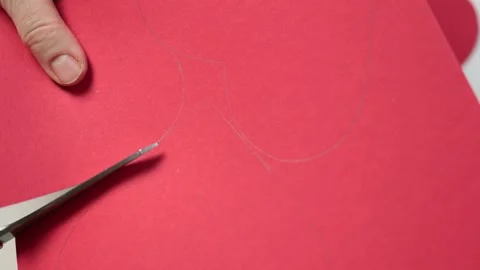 Cutting out red heart shape from paper cardboard Valentines day love concept Video stock 166171485