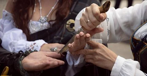 Cutting the palm with a knife. Stock Photos