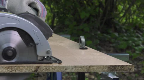 Cutting a panel with a circular saw Video stock 63506288