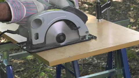 Cutting a panel with a circular saw Video stock 63506851