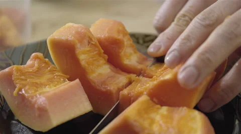 Cutting Papaya into cubes. 4K UHD. Stock-Footage 49731910