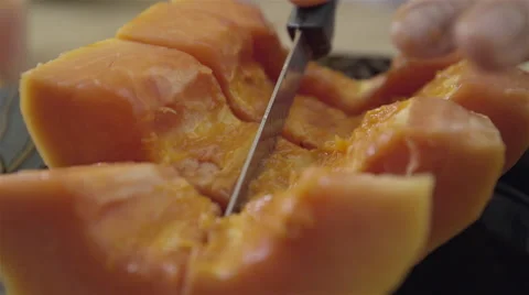 Cutting Papaya into cubes. 4K UHD. Stock-Footage 49732784