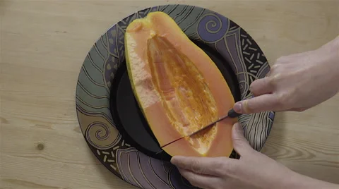 Cutting a Papaya fruit. 4K UHD. 動画素材 49729801
