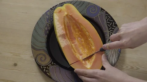 Cutting a Papaya fruit. 4K UHD. Video stock 49730265