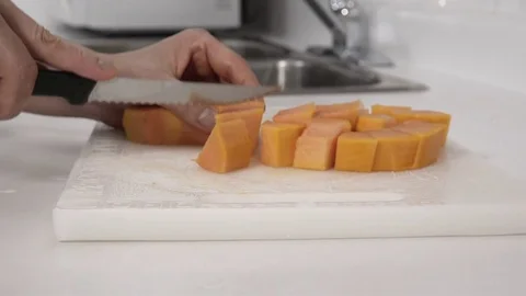Cutting a Papaya fruit. Stock Footage 77737733