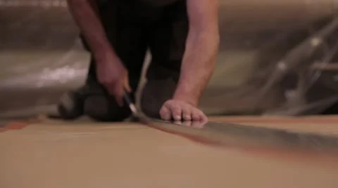 Cutting paper on the floor Stock Footage 65305743