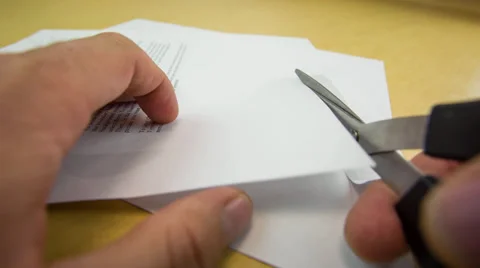 Cutting Paper with scissors close up Stock Footage 32243251
