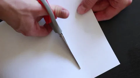 Cutting paper with scissors Stock-Footage 65371709
