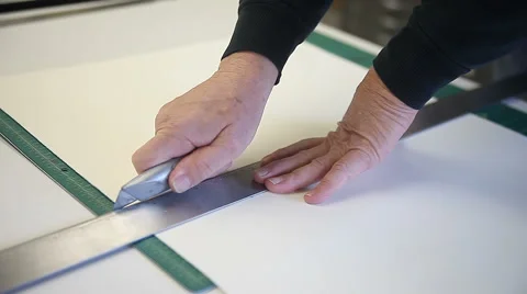 Cutting paper with straight edge Stock Footage 56661096