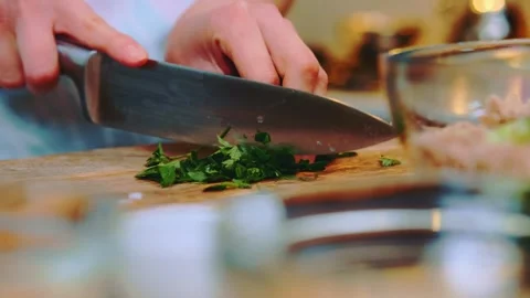 Cutting parsley on a cutting board Stock Footage 249079984