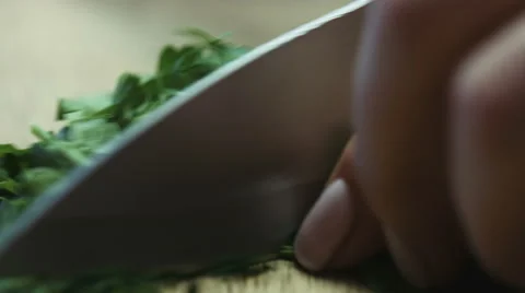 Cutting parsley with a knife closeup Stock Footage 62477117
