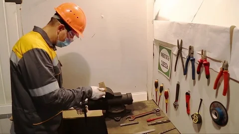 Cutting parts by electric tools in the workshop Stock Footage 84814416