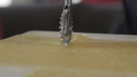 Cutting Pasta in Several Slice Stock Footage 85884835
