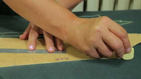 Cutting patterns of faux fur in the Studio Stock Footage 94102600