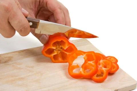Cutting pepper on the board Stock Photos