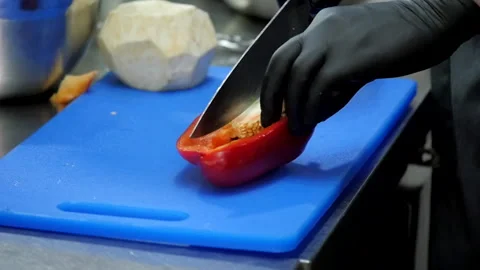 Cutting the Pepper into Two Quarters Stock Footage 131638755