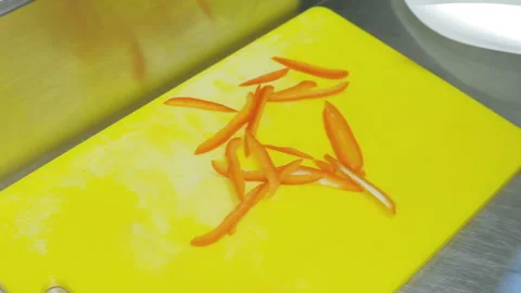Cutting the peppers cook. Video stock 93369469