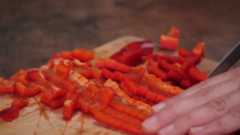 Cutting peppers - preparing a meal / close up Stock Footage 154002903