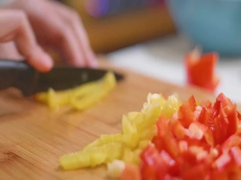 Cutting peppers in slow motion Stock Footage 80562272