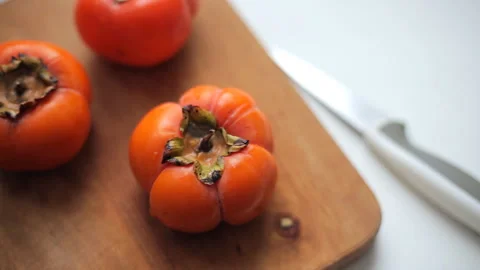 Cutting persimmon with a knife 스톡 동영상 99959707
