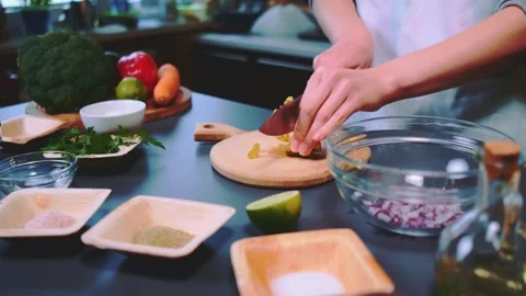 Cutting pickled cucumbers on the kitchen Stock Footage 252288404