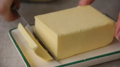 Cutting Off A Piece Of Butter Stock Footage 65774099