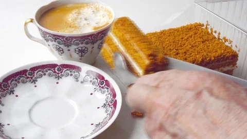 Cutting a piece of cake with a knife on the table 库存影片 102490844