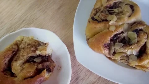 Cutting a piece of delicious moist fiadoe with raisin filling falling out. Stock Footage 281020522