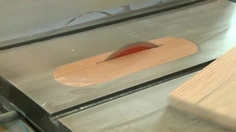 Cutting a piece of lumber on a table saw.  With sound. Stock Footage 20527669