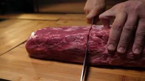 Cutting a piece of meat 50fps 動画素材 229933454