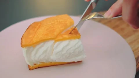 Cutting off a piece of omelet with a knife Video stock 249366807
